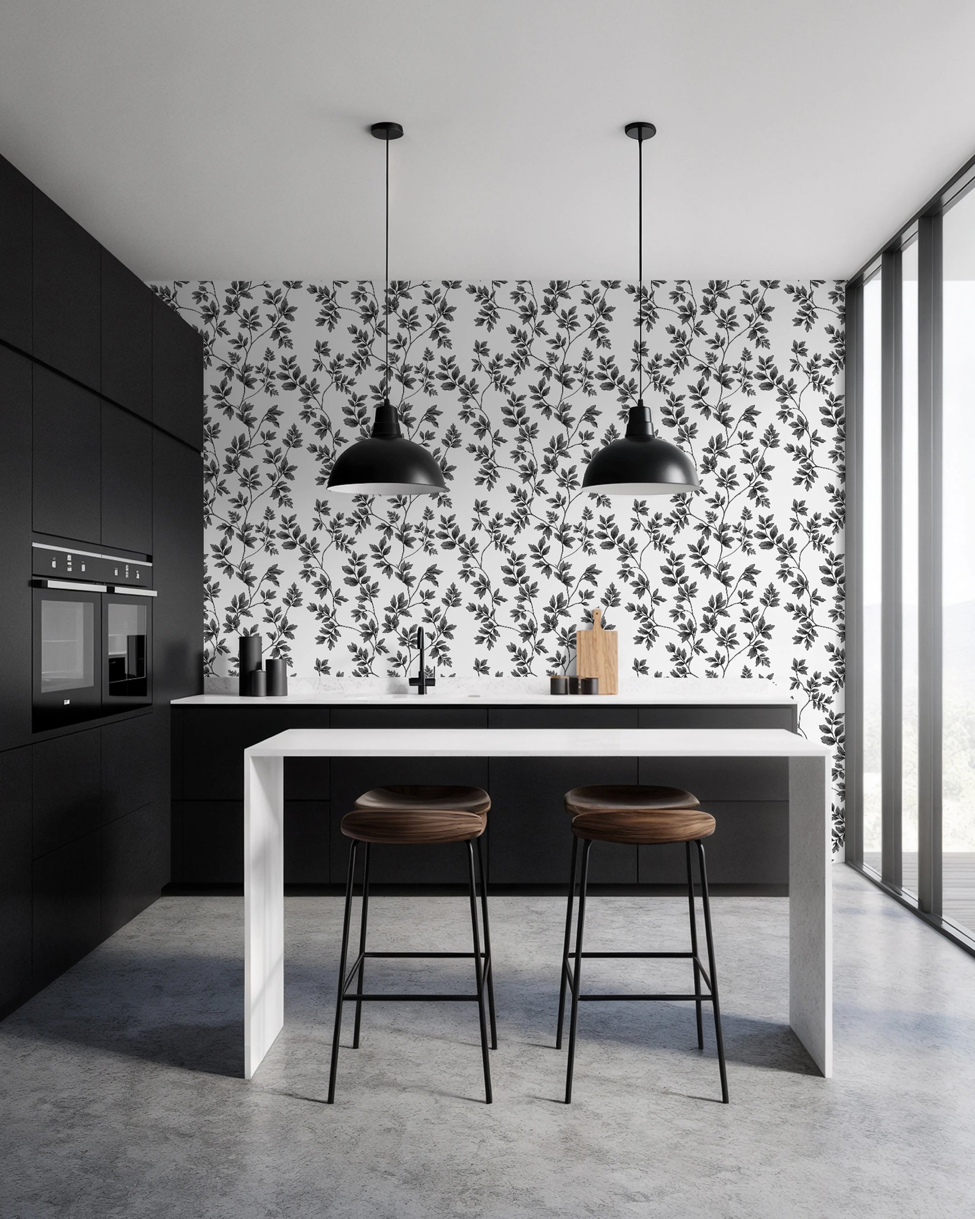 Modern kitchen with floral wallpaper by Buffalo Bunny, black pendant lights, and wooden stools.