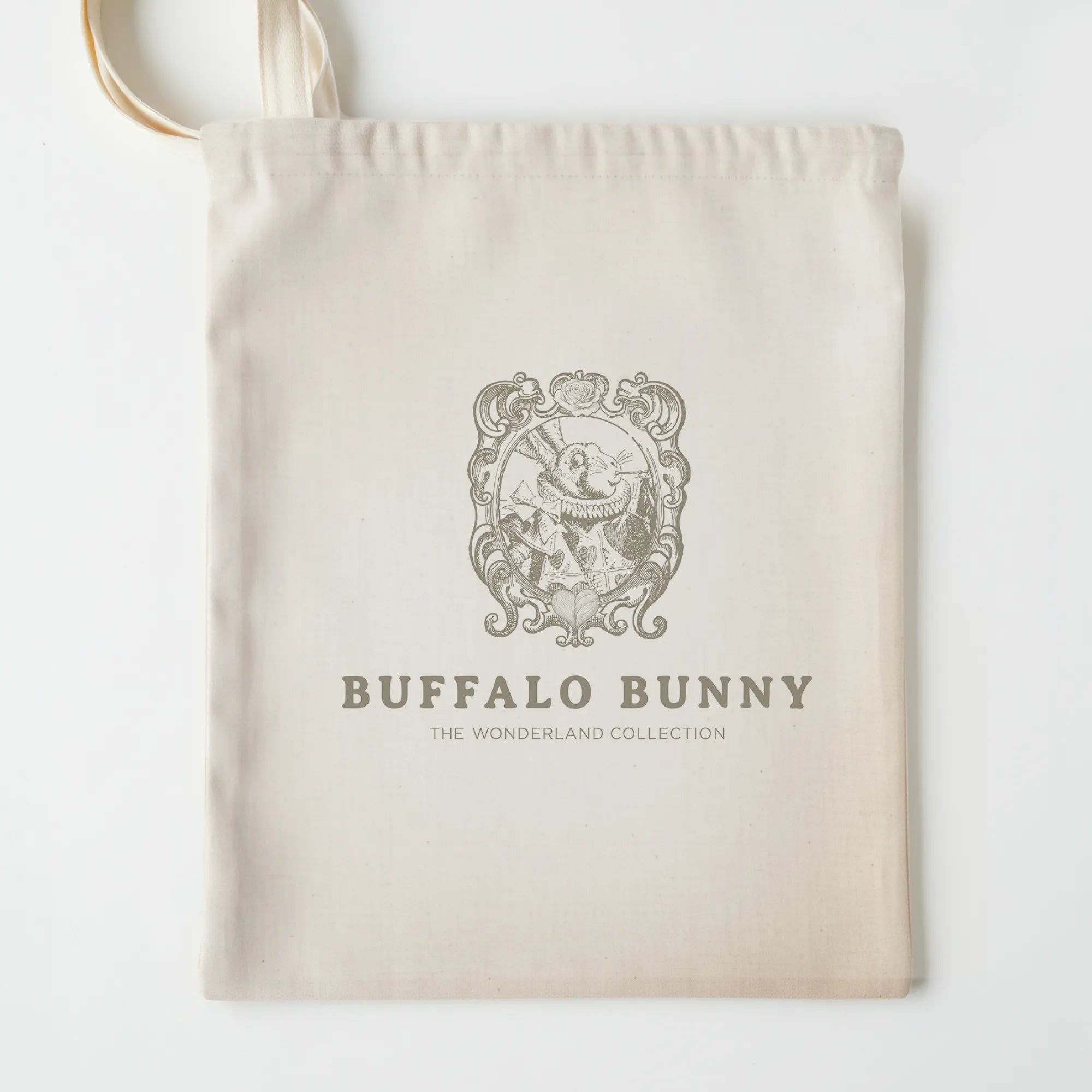 Beige pillow bag with 'Buffalo Bunny' logo and text on a white background