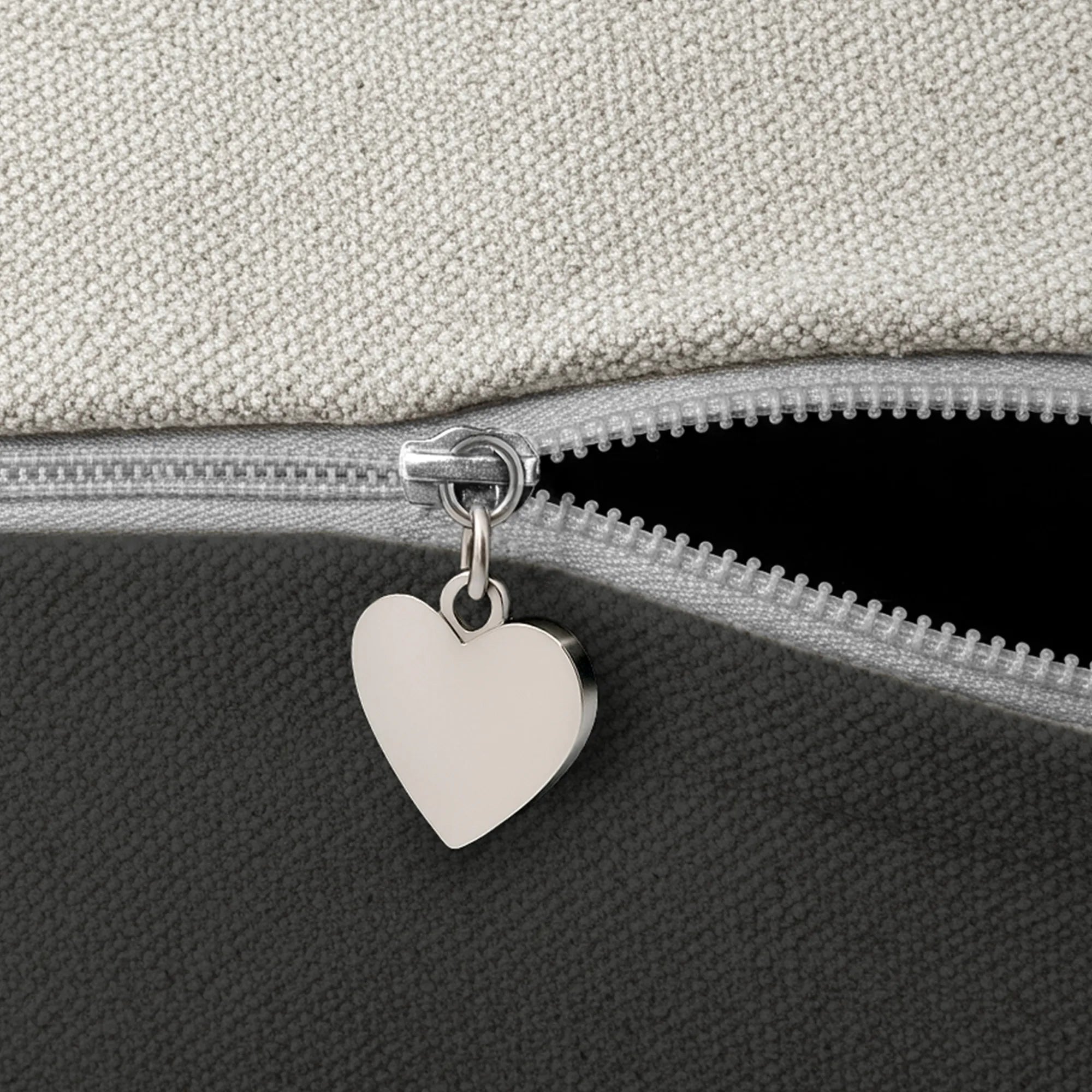 Heart-shaped charm on a zipper by Buffalo Bunny.