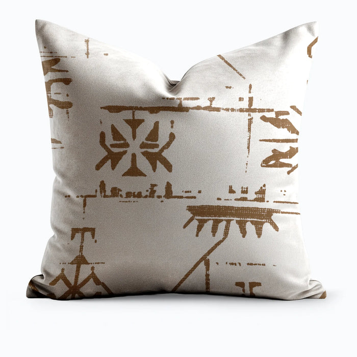 Ancient Glyph Script throw pillow showing warm amber glyph motifs on an ivory ground, product shot