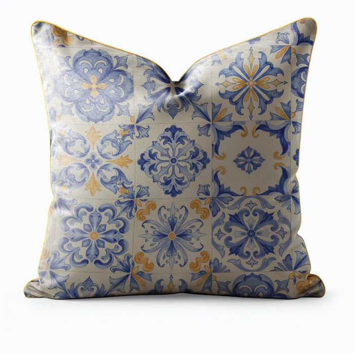 Decorative pillow by Buffalo Bunny with blue and yellow floral pattern on a white background