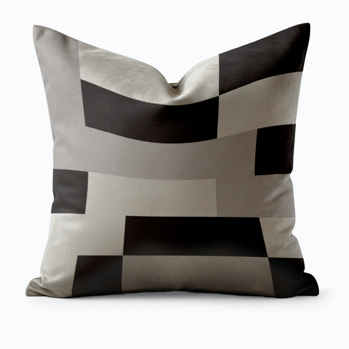 Decorative pillow with black and gray geometric pattern on a white background by Buffalo Bunny.