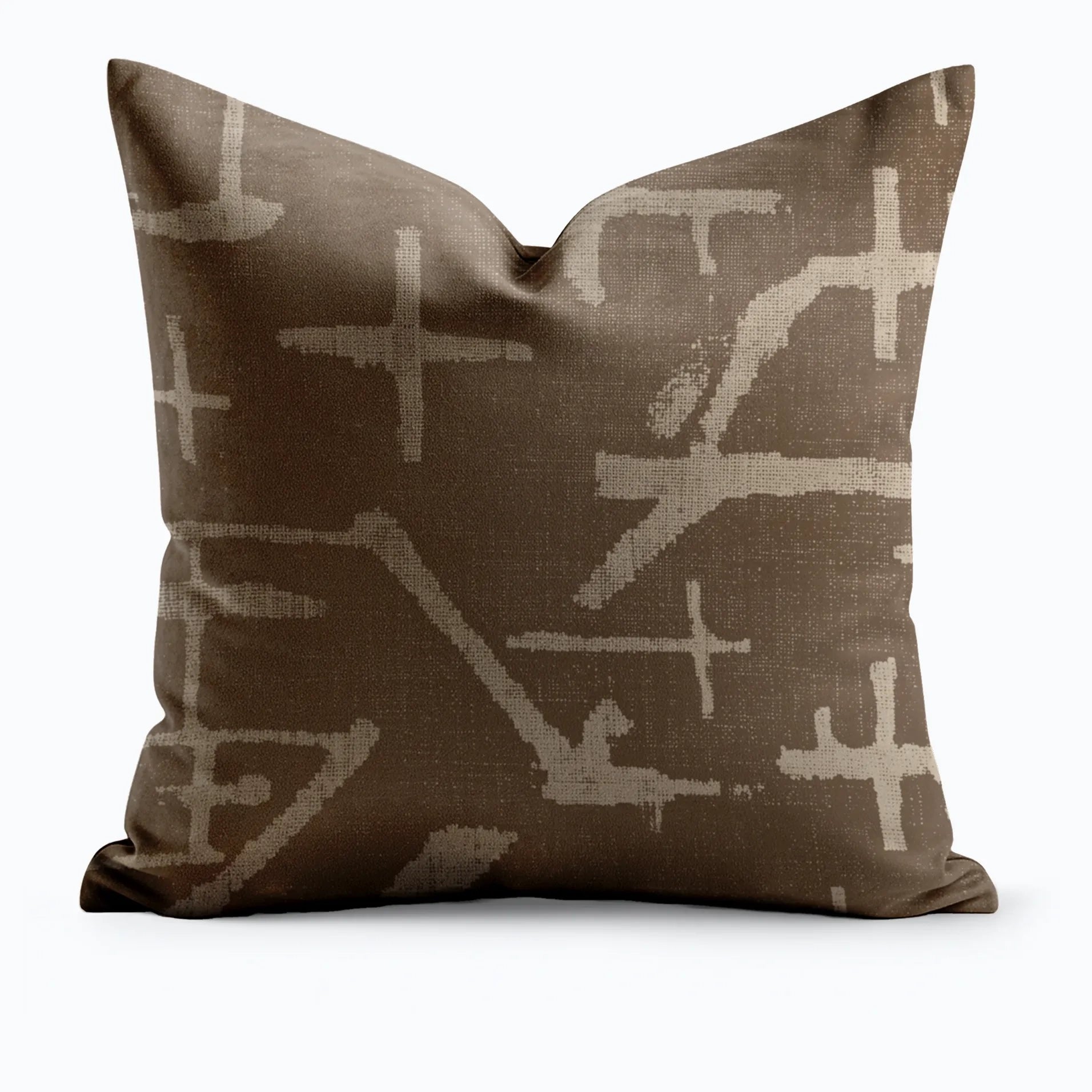 Desert Mark throw pillow with large-scale abstract cross and line marks in sand on dark chocolate brown