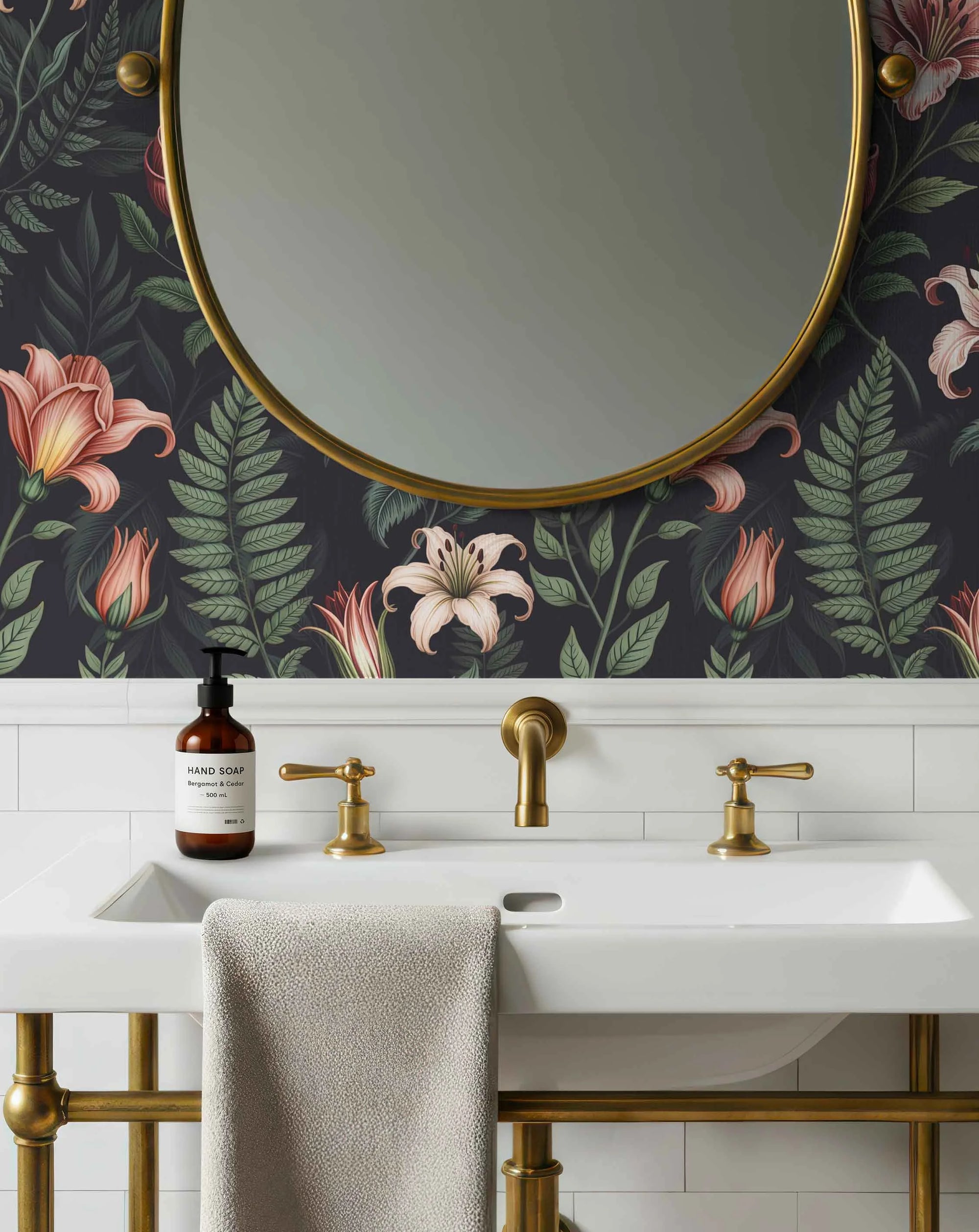 Bathroom with floral wallpaper, round mirror, and floral pattern wallpaper with pink lilies, roses, green leaves on a dark background