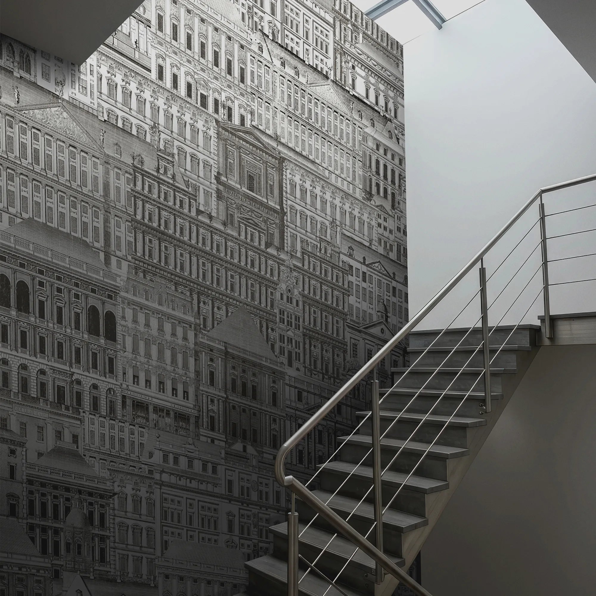 Staircase leading up to a textured wall with architectural pattern