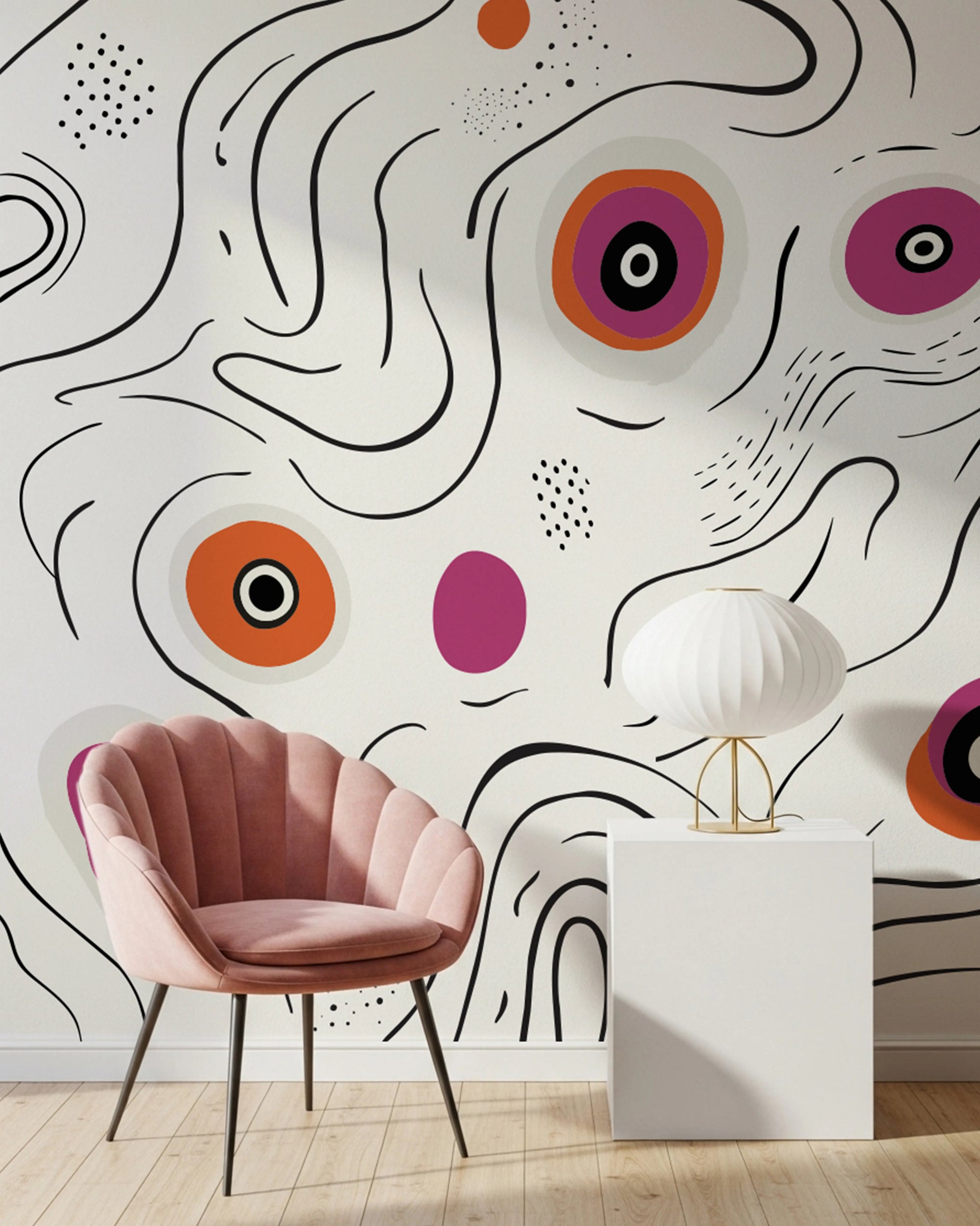 Modern interior with a pink chair and white table against a colorful abstract wall mural.