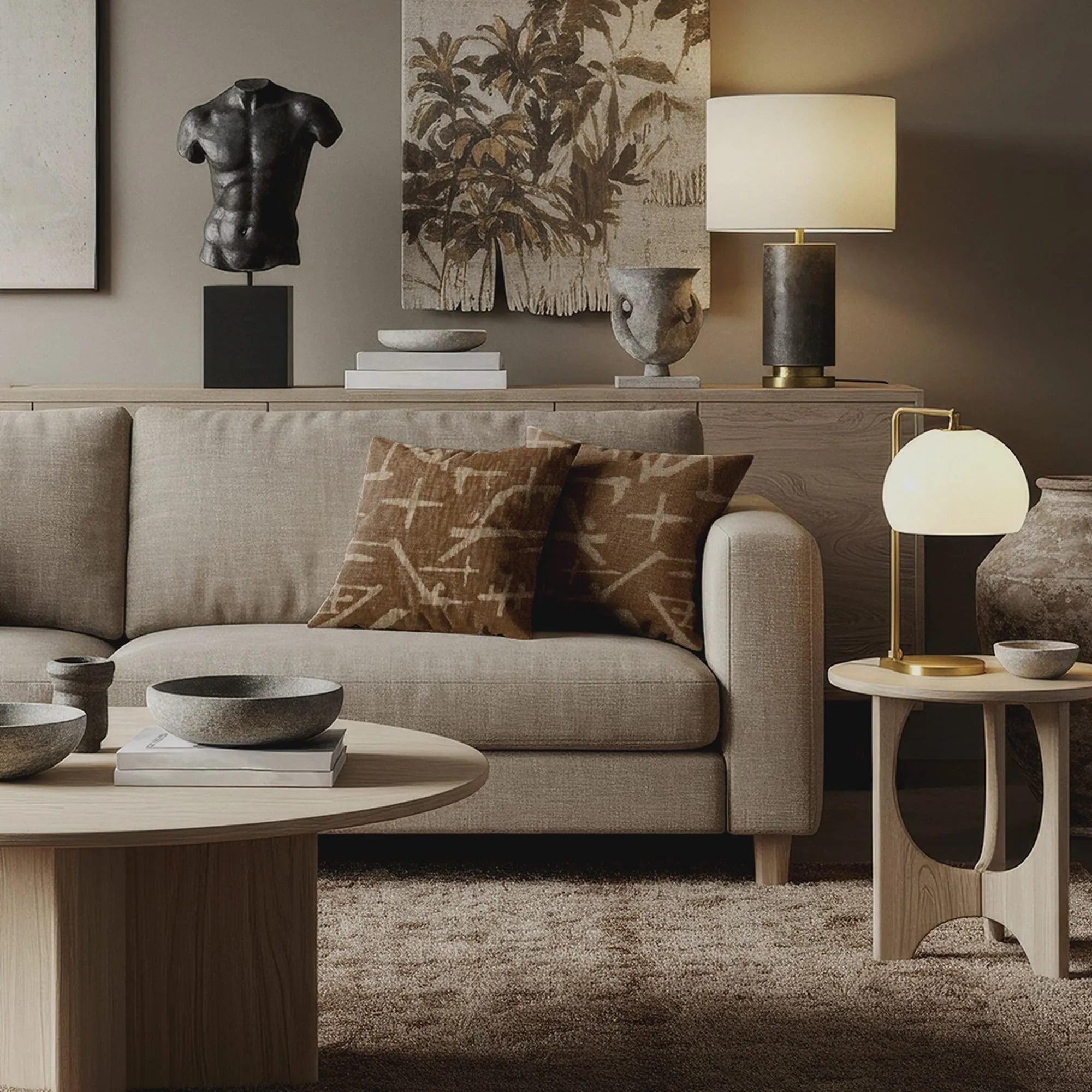 Brown throw pillows with abstract beige cross and line pattern on neutral beige sofa in modern, earthy living room.