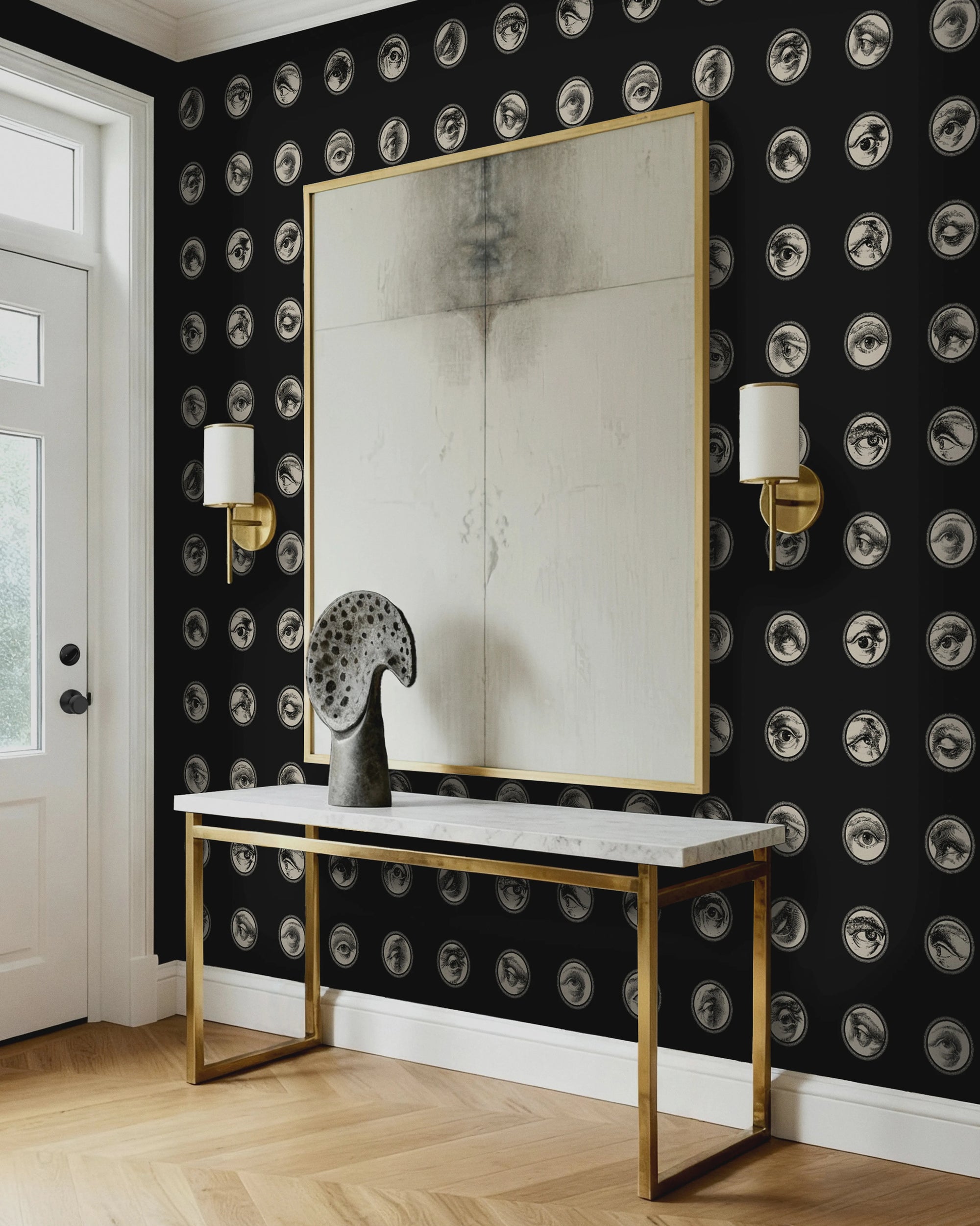 Foyer with black and white patterned wallpaper from Buffalo Bunny, gold console table, and a mirror.