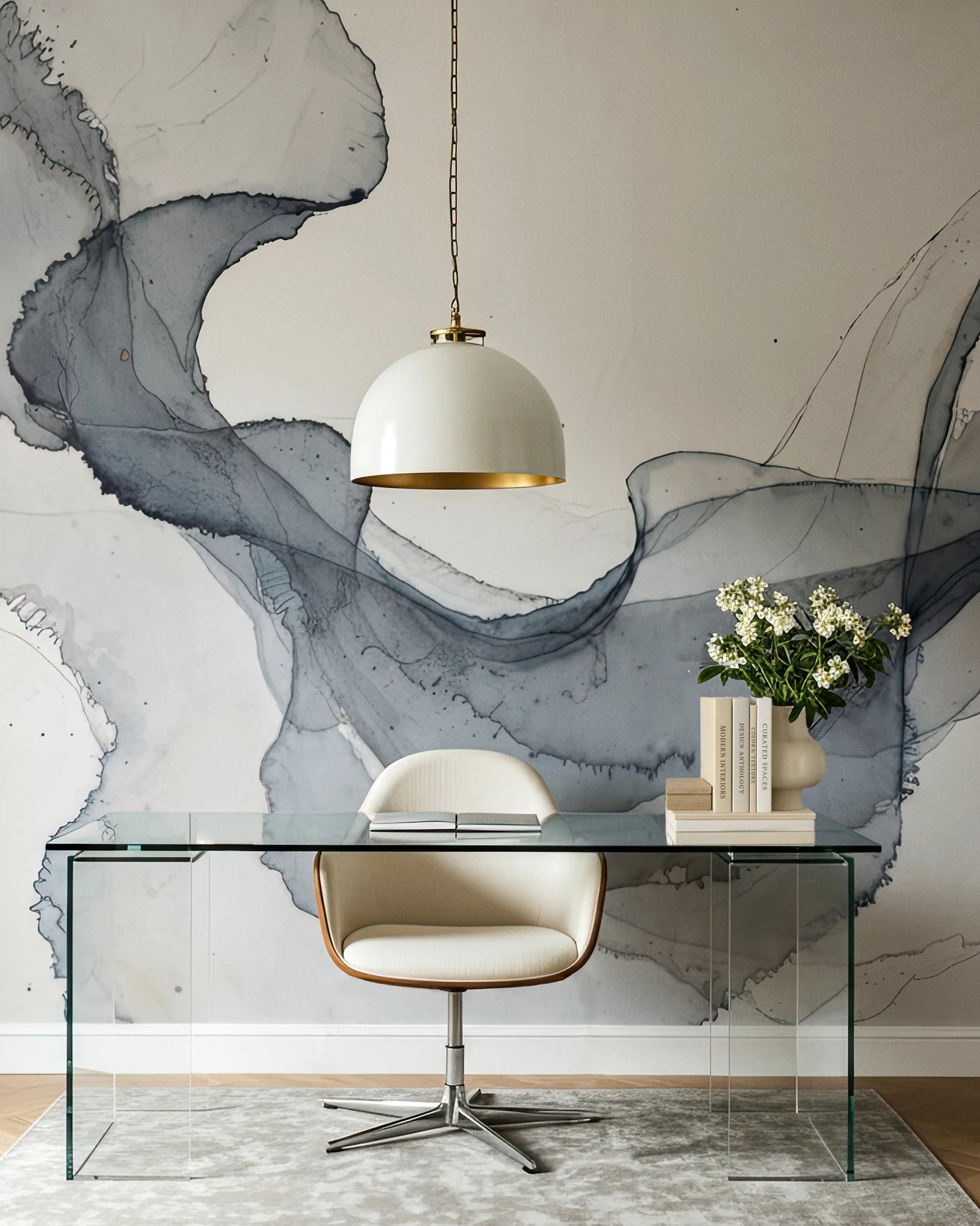 Modern office setup with glass desk, white chair, and abstract wall mural by Buffalo Bunny.