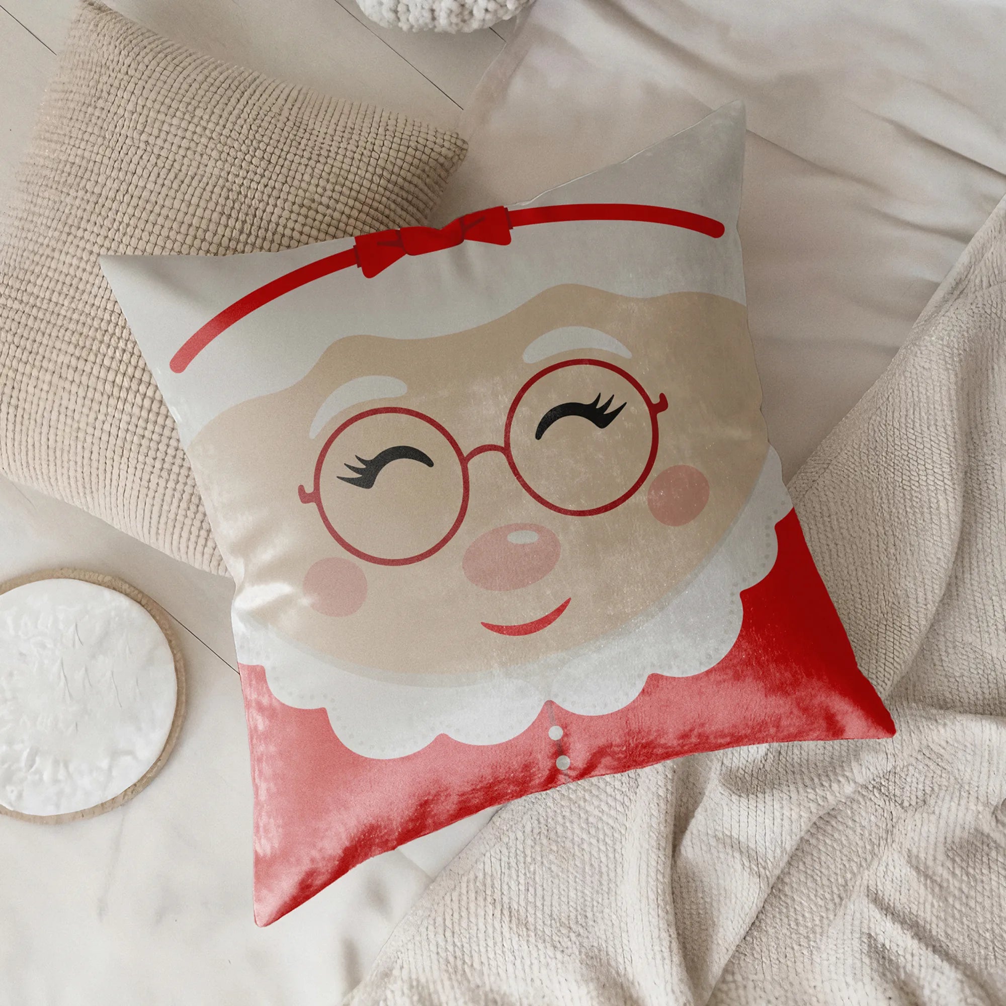 Decorative pillow with a Mrs. Claus face design  by Buffalo Bunny.