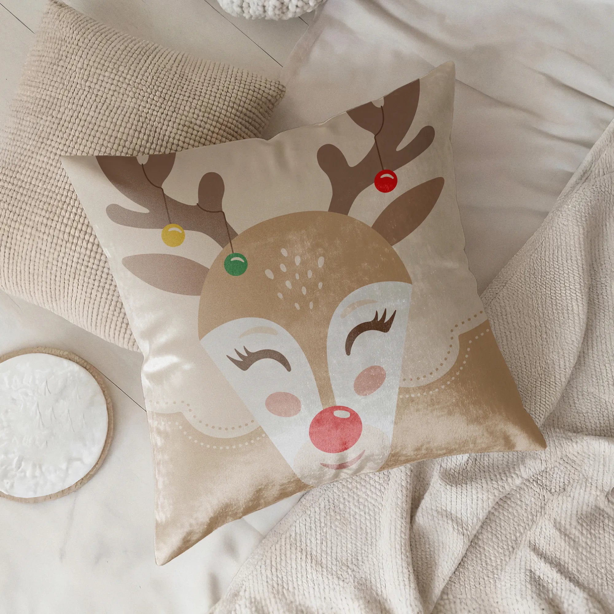 Decorative pillow with a reindeer design by Buffalo Bunny.