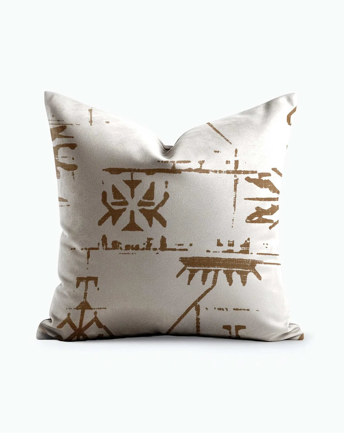 Ancient Glyph Script throw pillow showing warm amber glyph motifs on an ivory ground, product shot