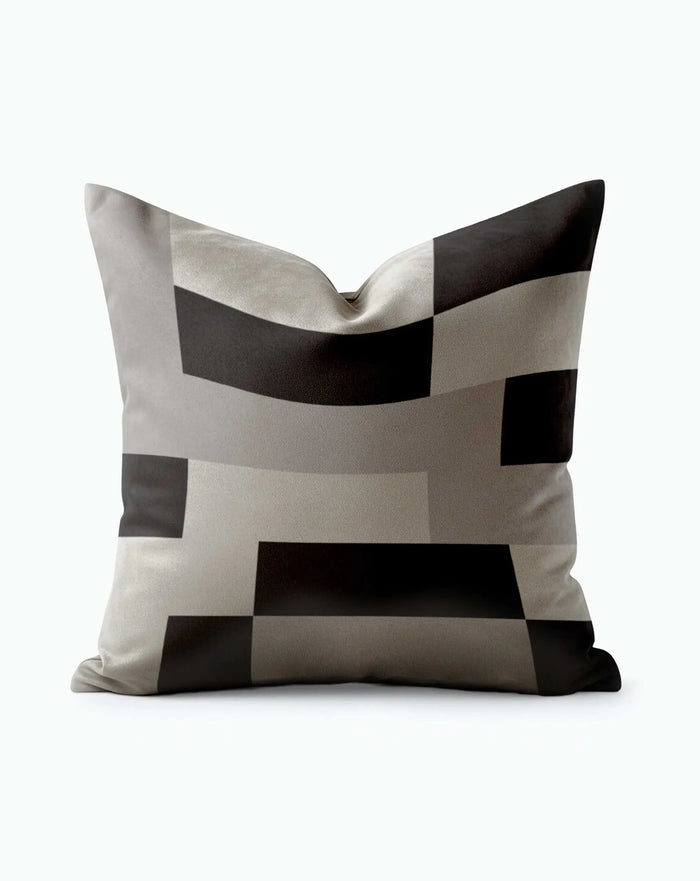 Monochrome Grid Throw Pillow with bold black and silver geometric block pattern
