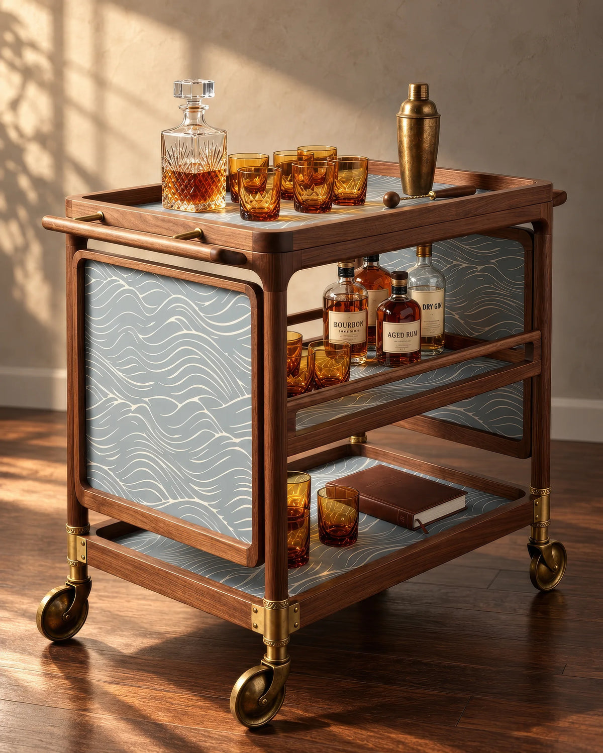 Quiet Current wallpaper lining a walnut bar cart with brass casters and amber glassware